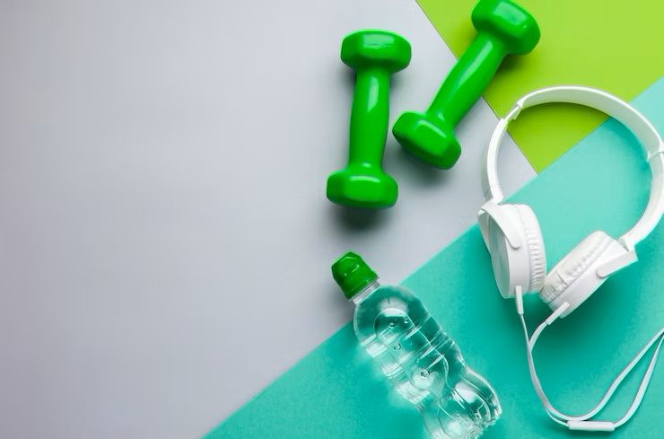 flat-lay-frame-with-headphones-and-dumbbells_23-2148259091.jpg