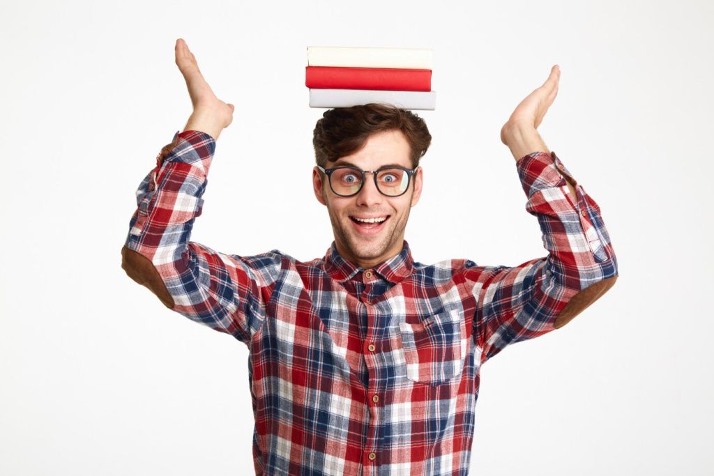 portrait-happy-excited-male-student-holding-books_171337-9152.jpg