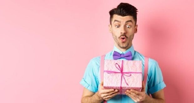 holidays-and-celebration-concept-handsome-guy-in-bowtie-receiving-birthday-gift-looking-at-present-i_1258-158343.jpg