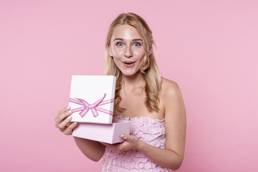 exited-woman-opening-gifts-at-party.jpg