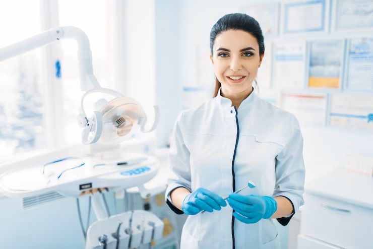 smiling-female-dentist-in-uniform-and-gloves-dental-clinic-professional-pediatric-dentistry-children-stomatology_266732-4126.jpg